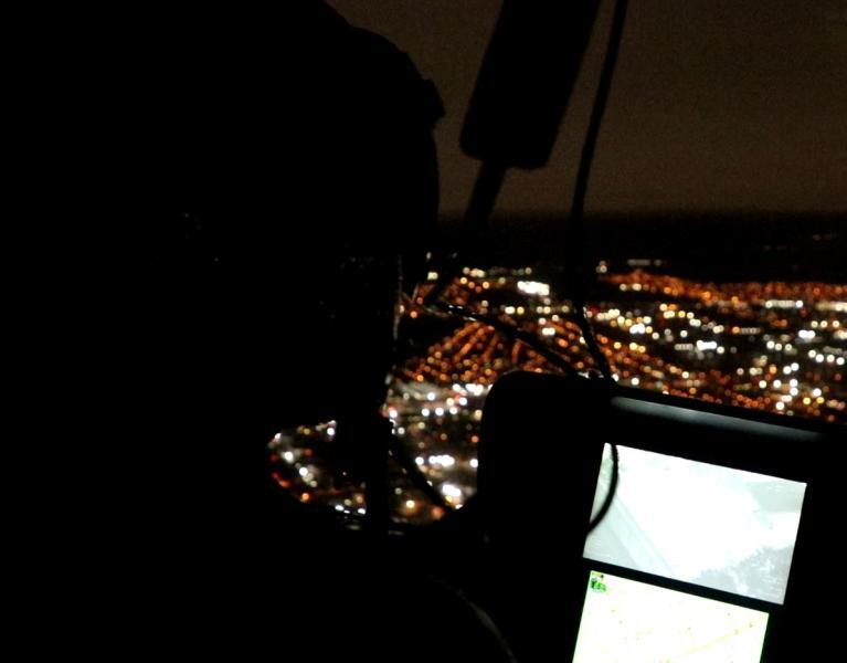 AMO Secures New Orleans Mardi Gras Parades from Air and River AMO pilot in cockpit of AS350