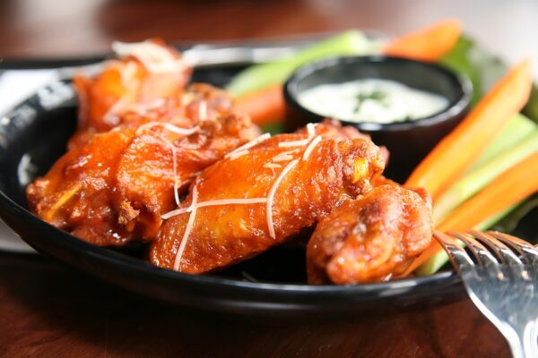 Despite rising costs, Americans will still eat 1.2 billion chicken wings during Superbowl weekend