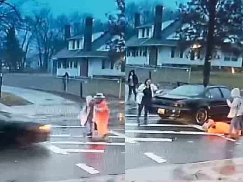 Watch as heroic police officer sacrifices herself to save child from being hit by speeding car