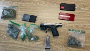 Suspect arrested and charged with handgun violations following traffic stop