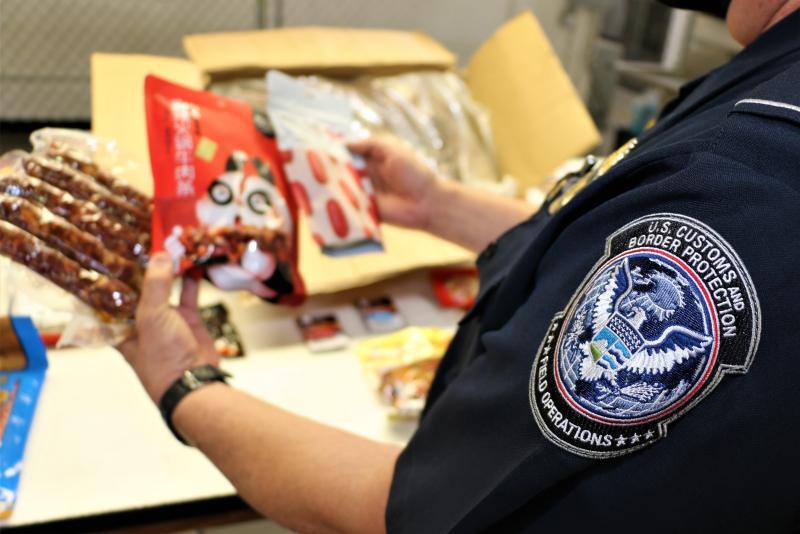 Animal Food Contraband from China Remains at Record Levels at LA/LB Seaport Agriculture Specialist inspects Animal Food Contraband