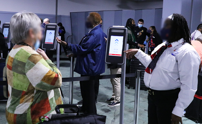 CBP Expands Facial Biometrics to Mobile, Alabama Cruise Ship Terminal passenger approaches the biometric facial comparison machine while Carnival Cruise Line employee stands nearby