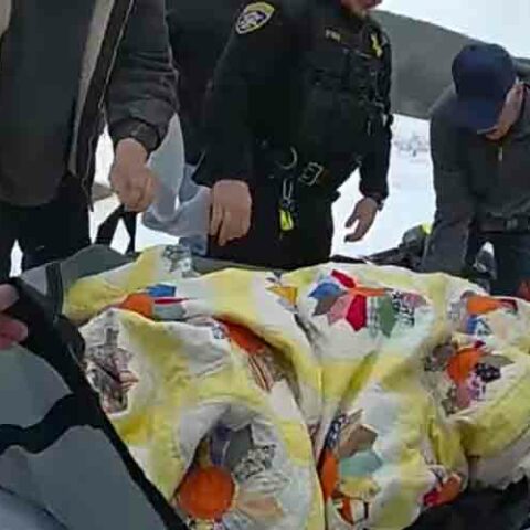 New york state troopers rescue fisherman who fell through ice - photo licensed by shore news network.