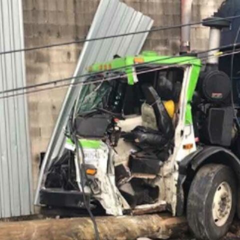 Garbage truck driver extricated by fdny after colling with wall, telephone pole - photo licensed by shore news network.