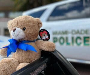 Miami-dade police receive 100 teddy bears for abused, neglected children