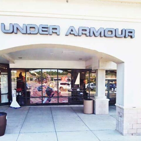 Three female shoplifters pack bags and walk out of jackson outlets store with stolen goods - photo licensed by shore news network.