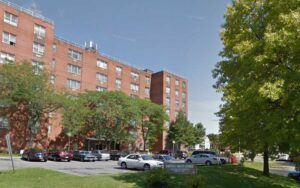 Utica woman finds bullet hole in living room window and wall