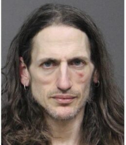 After smashing cars in parking lot, police charge utica man