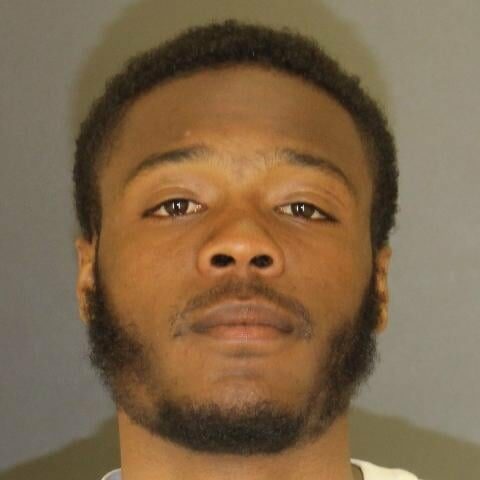 Baltimore homicide suspect attempts to escape police headquarters - photo licensed by shore news network.