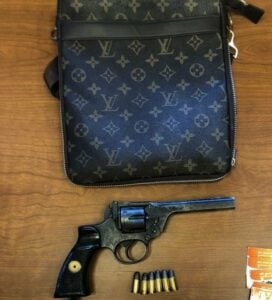 Recently released parolee tossed louis vuitton bag with gun as he fled police