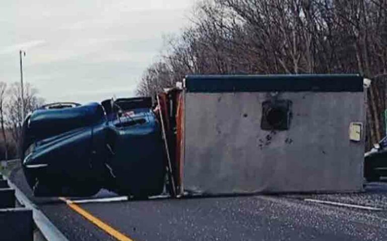 Police searching for suspect who fled scene after crashing into big green truck pizza truck - photo licensed by shore news network.