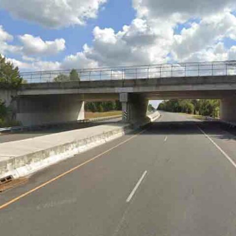 Mack truck with elevated boom slams into overpass on a. C. Expressway - photo licensed by shore news network.
