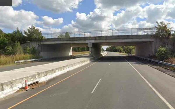 Mack Truck With Elevated Boom Slams Into Overpass on A.C. Expressway