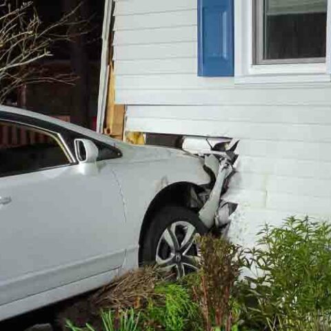 Teen crashed car into home, fled scene - photo licensed by shore news network.