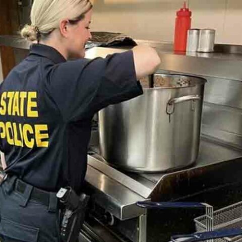 Police officers join millsville elks club to feed the community - photo licensed by shore news network.