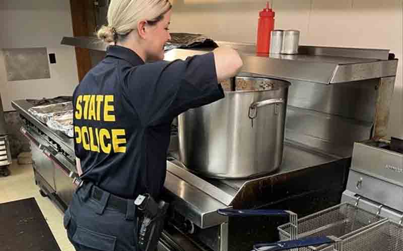 Police Officers Join Millsville Elks Club to Feed the Community