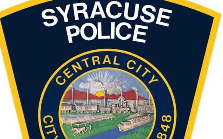 Officer saves six people from burning building in syracuse - photo licensed by shore news network.