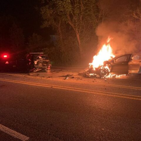 Impaired driver in ford fusion crashes into police car, car bursts into flames - photo licensed by shore news network.