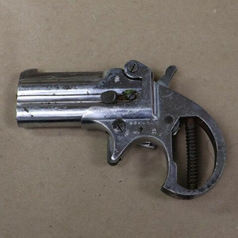 Two-shot historic derringer confiscated by police during arrest - photo licensed by shore news network.
