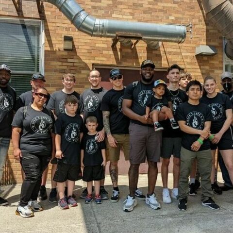 Utica police officers accompany local kickboxing kids to junior olympic event - photo licensed by shore news network.