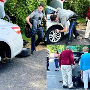 Connecticut state police officer delivers roadside service to elderly couple - photo licensed by shore news network.