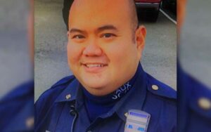 Auxiliary police officer recognized for saving four dogs from burning home