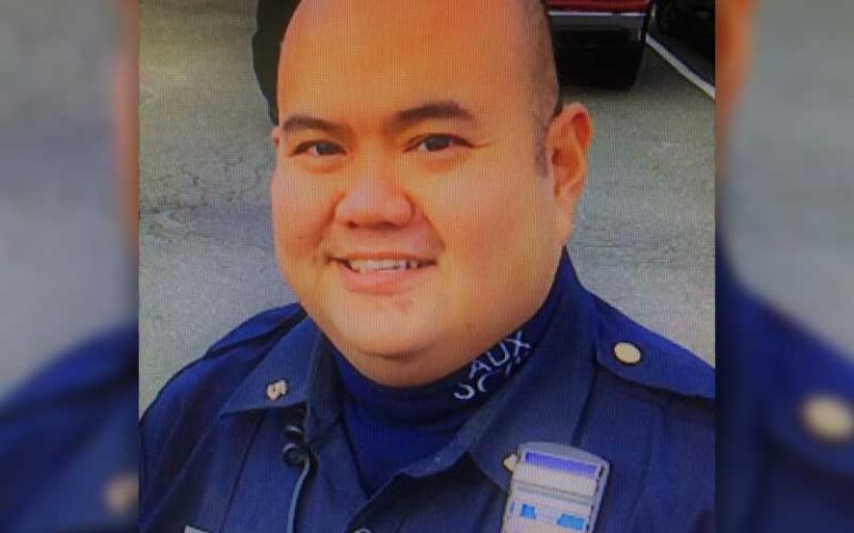 Auxiliary police officer recognized for saving four dogs from burning home - photo licensed by shore news network.