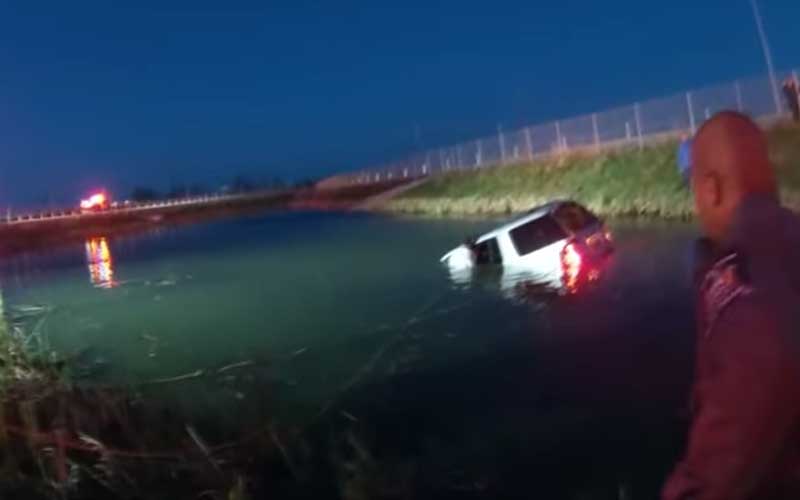 Footage of Daring Police Rescue of Driver from Car in Pond Released by Police