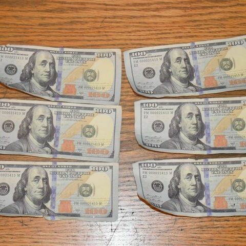 Are they real? Man passes realistic counterfeit $100 bills at gas station - photo licensed by shore news network.