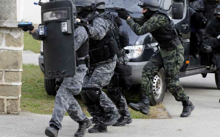 Suspect in march south side slopes murder barricades himself in home before removal by swat team - photo licensed by shore news network.