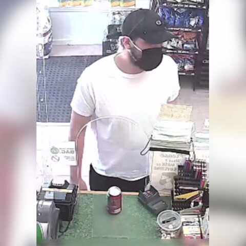Armed dollar store robber shows gun, flees after owner responded by showing his gun - photo licensed by shore news network.