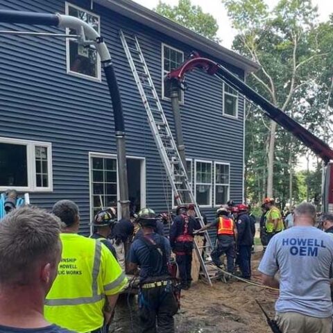 Worker rescued after being trapped in collapsed hole, 10 feet deep in howell - photo licensed by shore news network.