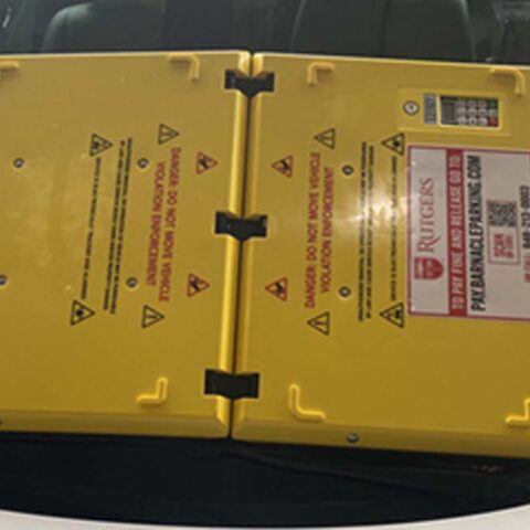 Rutgers university deploys parking barnacles to force people to pay parking tickets on the spot - photo licensed by shore news network.