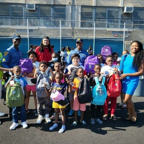Look at these smiling faces as newark police team up with community for back-to-school drive - photo licensed by shore news network.