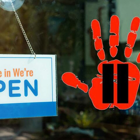 What's with this strange red hand print showing up on sussex county storefronts? - photo licensed by shore news network.