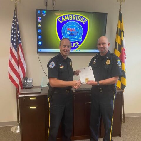 Cambridge police congratulate newest captain - photo licensed by shore news network.