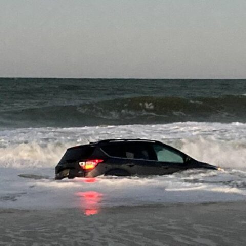 Drunk driver charged after driving car into ocean - photo licensed by shore news network.