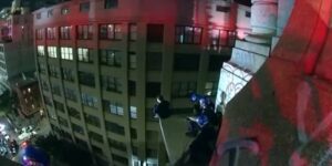 Watch: woman rescued from ledge of new york city building