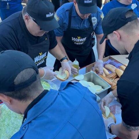 Voorhees police department celebrates new wawa opening with fire dept. Hoagie challenge - photo licensed by shore news network.
