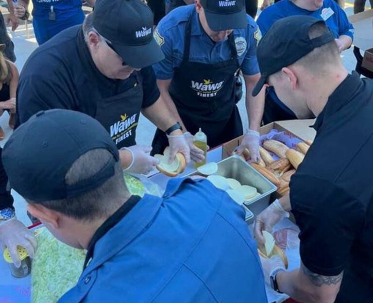 Voorhees police department celebrates new wawa opening with fire dept. Hoagie challenge - photo licensed by shore news network.
