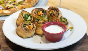 Old chicago pizza + taproom unveils chicago cheesesteak rolls