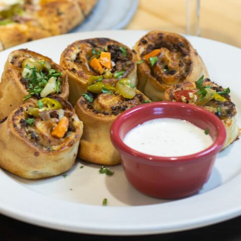 Old chicago pizza + taproom unveils chicago cheesesteak rolls - photo licensed by shore news network.