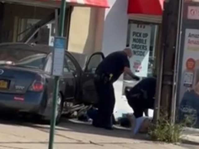 Suspect Fleeing from Police Carjacked Vehicle, Crashed into KFC