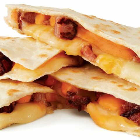 Taco john’s quadruples the cheese for an all new bigger. Bolder. Better. Quesadilla - photo licensed by shore news network.