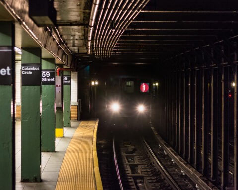 A train approaching the platform at Columbus Circle subway station in Manhattan, New York City - Photo by Jon Bilous,