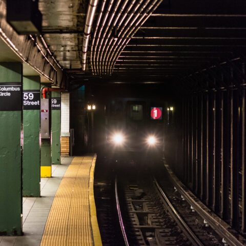 A train approaching the platform at columbus circle subway station in manhattan, new york city - photo by jon bilous,