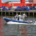 A NYC Police Dept. inflatable boat patrols New York Harbor. Photo 251231948 © John Penne