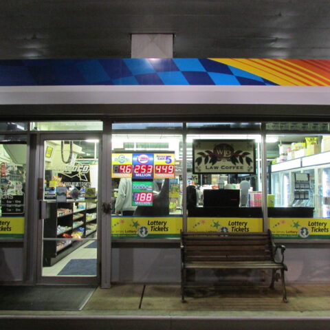 Gas station in nj at night with lottery jackpots. © valeriy grynkov