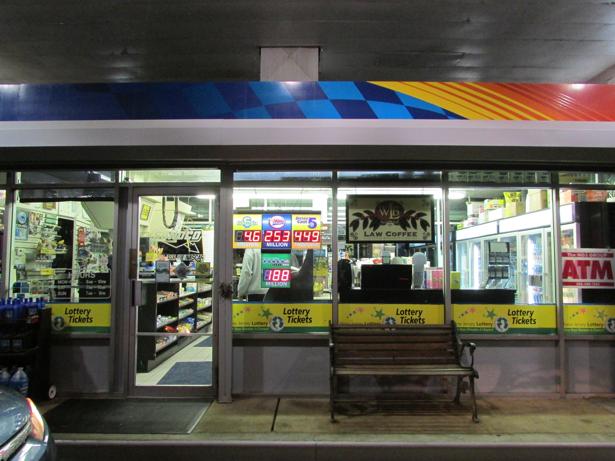Gas station in NJ at night with lottery jackpots. © Valeriy Grynkov