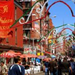 People stroll along Mulberry Street in the heart of New York City s famed Little Italy district during the annual San Gennaro street festival. © Lei Xu